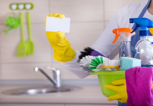 Cleaning professional preparing carpet cleaning equipment safely