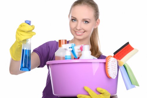 Dusting and sanitising desks in a Knightsbridge office