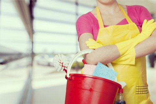 Cleaner maintaining a modern office kitchen in Knightsbridge